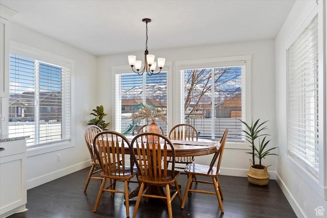 2588 S 1000 W, Nibley, UT 84321 - dining room featuring healthy amount of natural light, a chandelier, and dark wood-type flooring