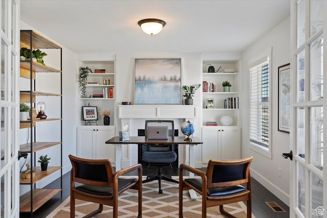 2588 S 1000 W, Nibley, UT 84321 - office with built in shelves, plenty of natural light, french doors, and baseboards