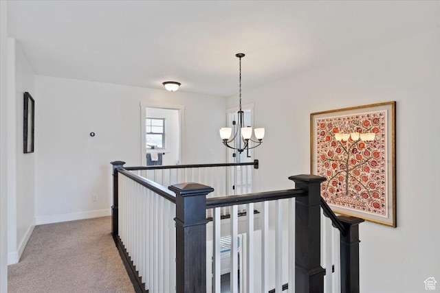 2588 S 1000 W, Nibley, UT 84321 - hallway featuring an upstairs landing, a chandelier, light colored carpet, and baseboards