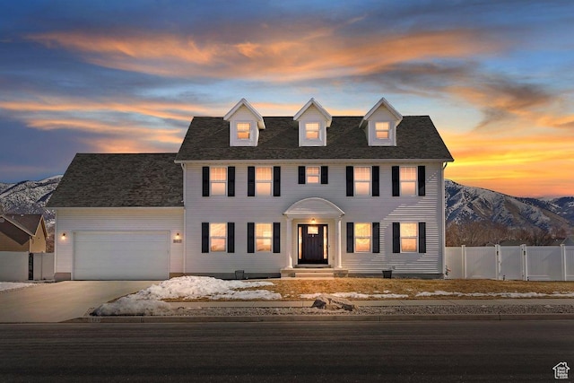 2588 S 1000 W, Nibley, UT 84321 - colonial inspired home featuring a garage, driveway, and a mountain view