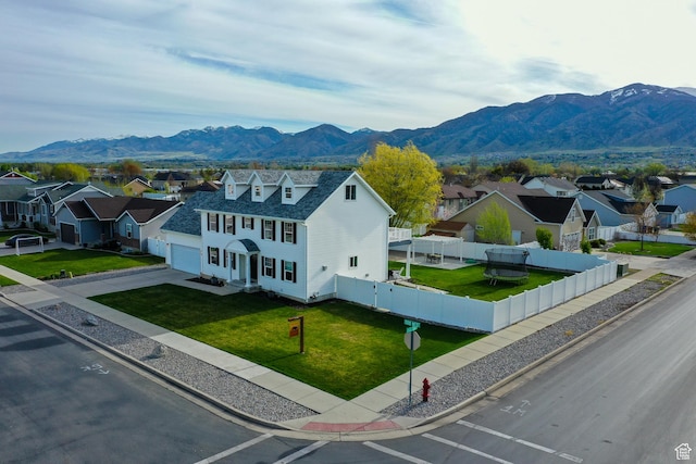 drone / aerial view featuring a residential view and a mountain view