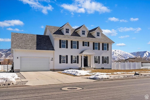 2588 S 1000 W, Nibley, UT 84321 - colonial inspired home featuring a mountain view, a garage, and concrete driveway