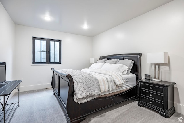 carpeted bedroom featuring baseboards