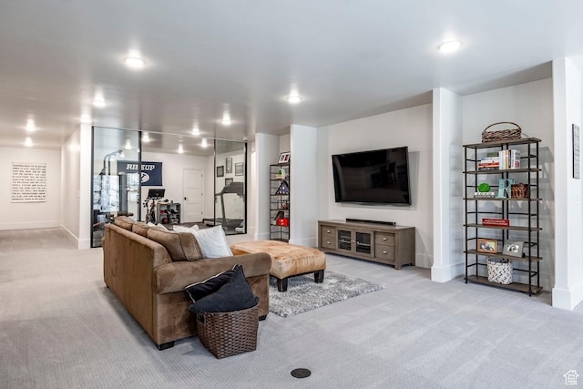 living area with carpet floors and baseboards