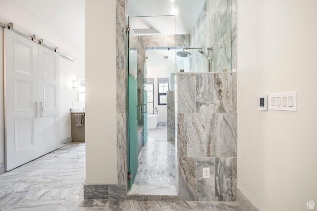 bathroom with a marble finish shower
