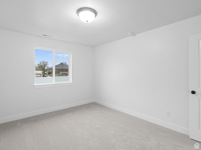 1171 W 800 S Unit 38, Spanish Fork, UT 84660 - unfurnished room featuring visible vents, baseboards, and light carpet