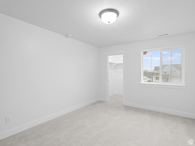 1171 W 800 S Unit 38, Spanish Fork, UT 84660 - empty room featuring light carpet, a textured ceiling, visible vents, and baseboards