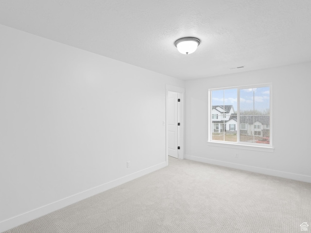 1171 W 800 S Unit 38, Spanish Fork, UT 84660 - empty room with baseboards, a textured ceiling, and light colored carpet