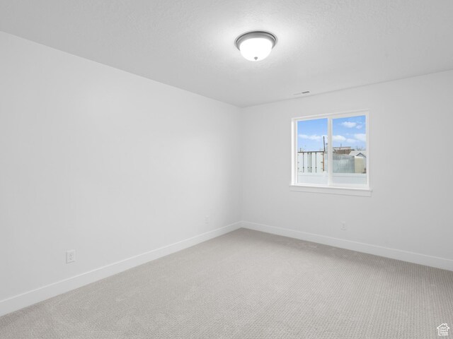 1171 W 800 S Unit 38, Spanish Fork, UT 84660 - empty room with visible vents, baseboards, and light colored carpet