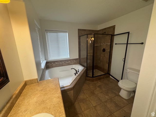 bathroom featuring a garden tub, visible vents, toilet, a stall shower, and tile patterned flooring