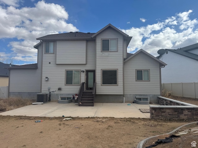 back of property featuring central AC, a patio area, and fence