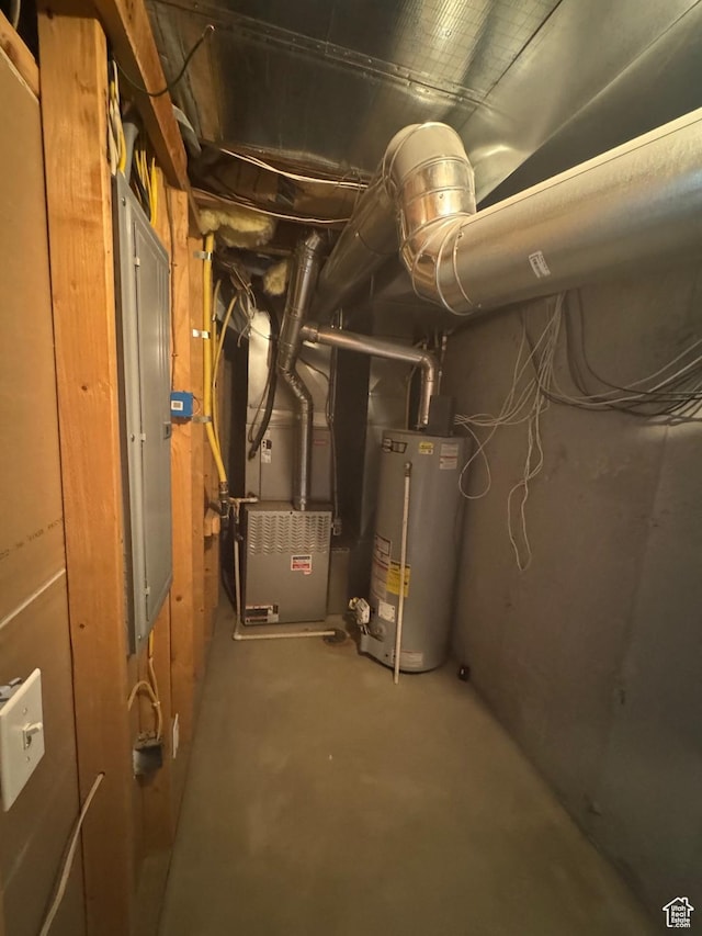 utility room with water heater, electric panel, and heating unit