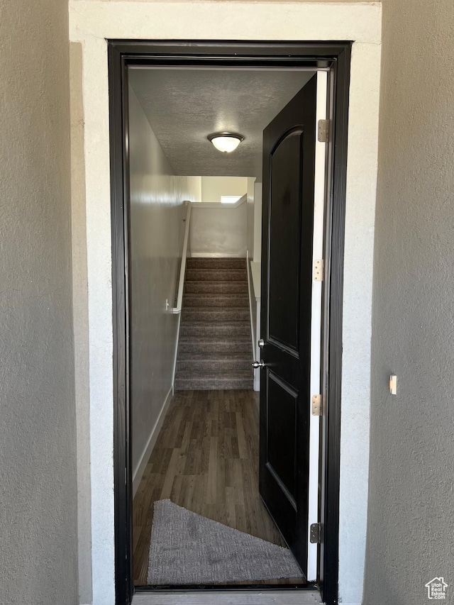 16368 S Coupler Ln, Bluffdale, UT 84065 - hallway with a textured ceiling, stairway, wood finished floors, and a textured wall