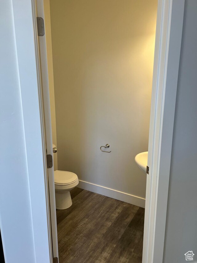 16368 S Coupler Ln, Bluffdale, UT 84065 - bathroom with wood finished floors, toilet, and baseboards