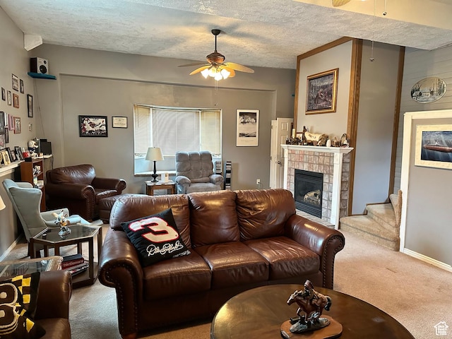 371 S Willard Peak Rd S, Mantua, UT 84324 - carpeted living room with a ceiling fan, a textured ceiling, a fireplace, baseboards, and stairs
