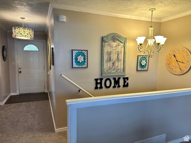 371 S Willard Peak Rd S, Mantua, UT 84324 - carpeted entryway featuring a notable chandelier, baseboards, a textured ceiling, and ornamental molding