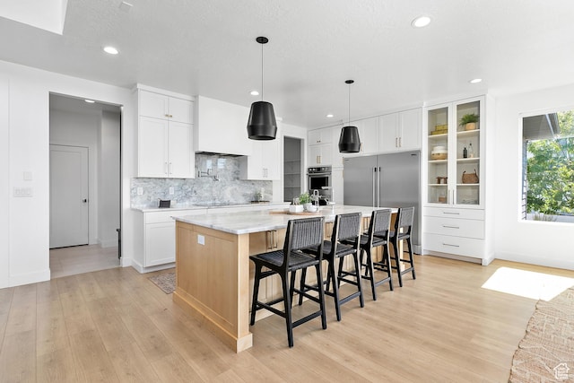 1228 E 1030 N, American Fork, UT 84003 - kitchen featuring backsplash, light wood-style flooring, recessed lighting, a large island, and stainless steel appliances