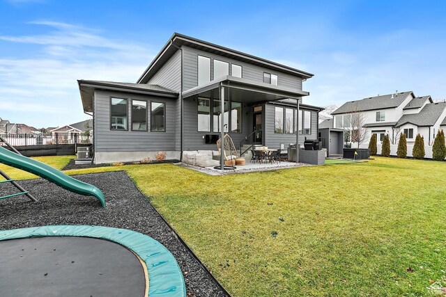 1228 E 1030 N, American Fork, UT 84003 - rear view of house with a patio area, a lawn, and a playground