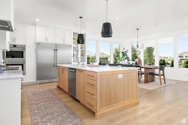 1228 E 1030 N, American Fork, UT 84003 - kitchen with appliances with stainless steel finishes, light wood-type flooring, light brown cabinets, light countertops, and recessed lighting