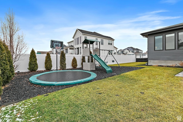 1228 E 1030 N, American Fork, UT 84003 - view of play area featuring a fenced backyard, a trampoline, and a lawn