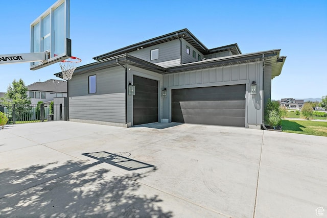 1228 E 1030 N, American Fork, UT 84003 - view of front facade featuring concrete driveway, board and batten siding, and a garage