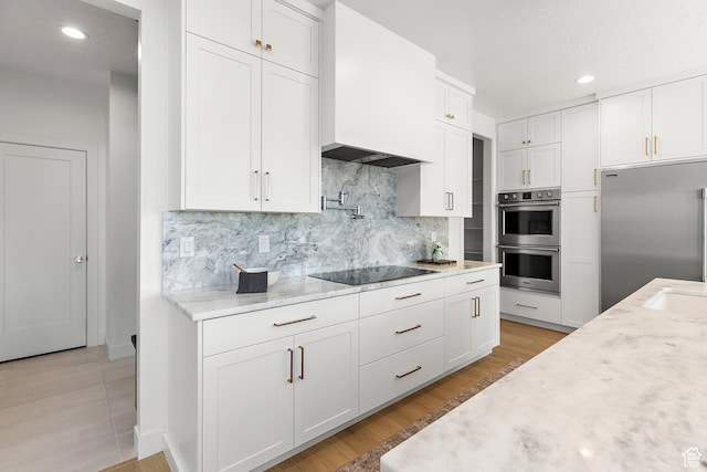 1228 E 1030 N, American Fork, UT 84003 - kitchen featuring appliances with stainless steel finishes, white cabinets, backsplash, recessed lighting, and light wood-type flooring