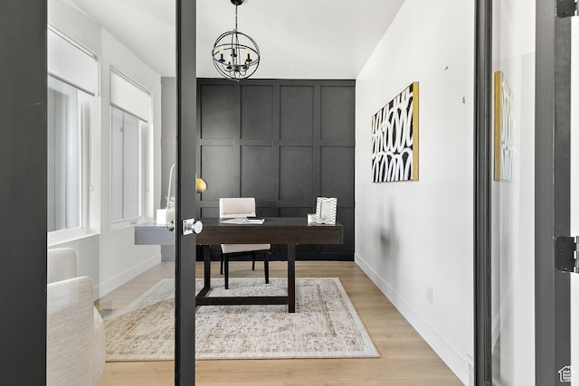 1228 E 1030 N, American Fork, UT 84003 - office featuring light wood-style flooring, a chandelier, and a decorative wall