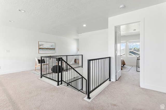 1228 E 1030 N, American Fork, UT 84003 - corridor with an upstairs landing, carpet floors, recessed lighting, and a textured ceiling
