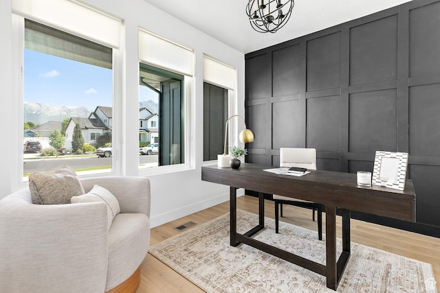 1228 E 1030 N, American Fork, UT 84003 - office space featuring a decorative wall, a chandelier, and light wood-style flooring