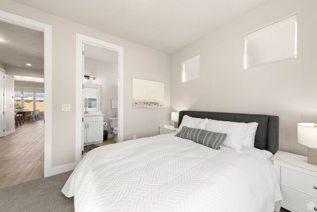 4712 W 2820 S, Hurricane, UT 84737 - bedroom with ensuite bathroom and baseboards