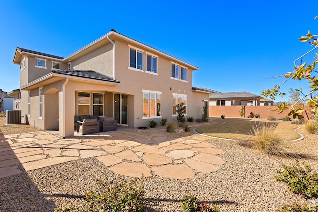 4712 W 2820 S, Hurricane, UT 84737 - rear view of house with central AC, stucco siding, fence, a patio area, and an outdoor hangout area