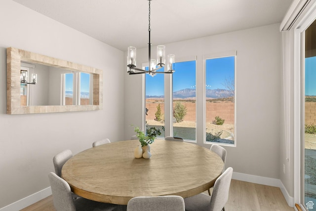 4712 W 2820 S, Hurricane, UT 84737 - dining space featuring a chandelier, baseboards, light wood-style flooring, and plenty of natural light