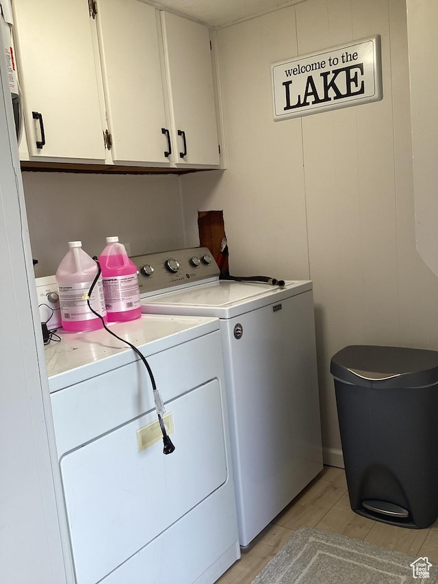 255 N 1st St E, Manila, UT 84046 - laundry room featuring cabinet space, separate washer and dryer, and light wood-style flooring