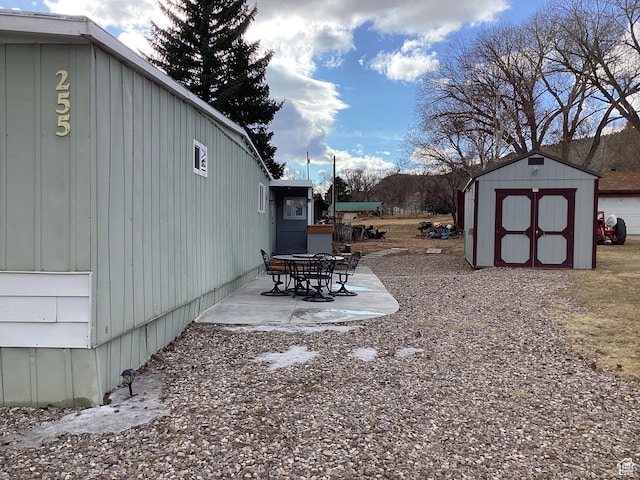 255 N 1st St E, Manila, UT 84046 - view of yard with an outdoor structure, a patio area, and a storage shed