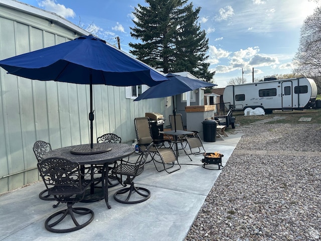 255 N 1st St E, Manila, UT 84046 - view of patio with outdoor dining area and an outdoor fire pit