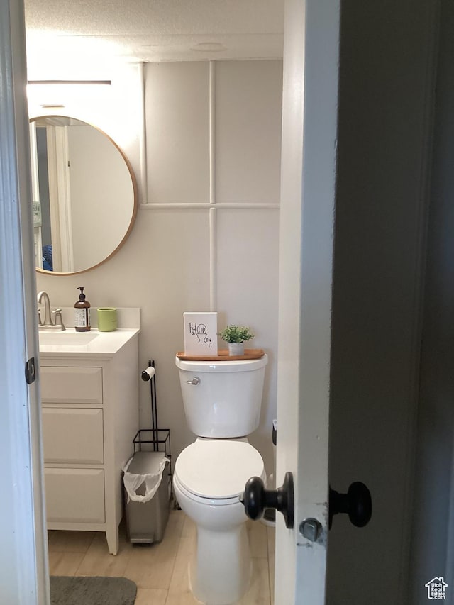 255 N 1st St E, Manila, UT 84046 - half bath featuring toilet, tile patterned flooring, and vanity