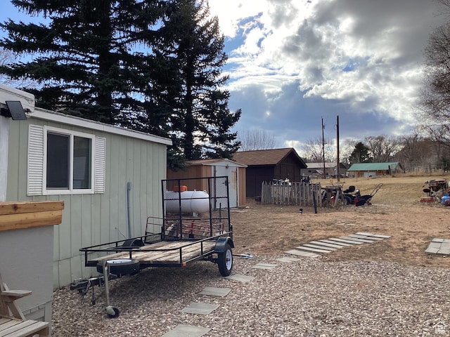 255 N 1st St E, Manila, UT 84046 - view of yard with fence, a shed, and an outbuilding