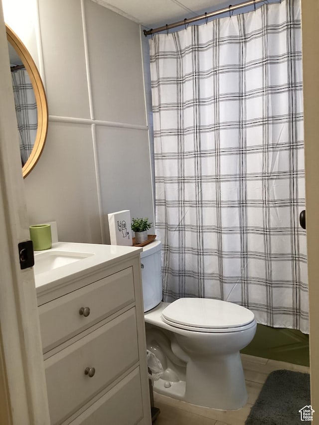 255 N 1st St E, Manila, UT 84046 - bathroom featuring toilet, tile patterned floors, vanity, and a shower with shower curtain