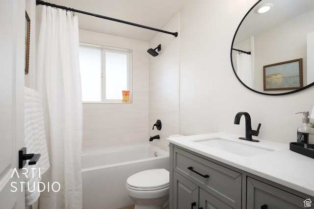 full bath with vanity, toilet, and shower / bath combo with shower curtain