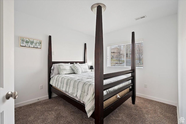 carpeted bedroom with visible vents and baseboards