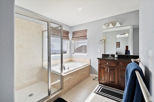 bathroom featuring a garden tub, vanity, tile patterned flooring, and a stall shower