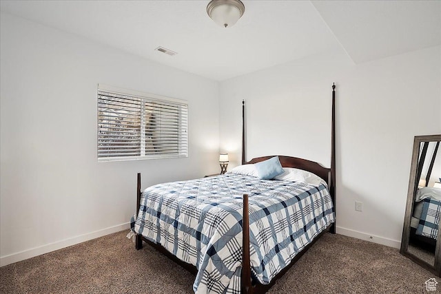 bedroom with baseboards, carpet, and visible vents