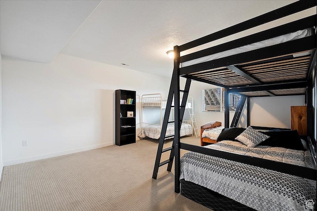 bedroom with carpet flooring and baseboards
