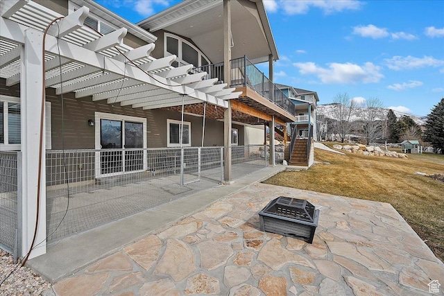 view of patio / terrace with a pergola, stairs, a fire pit, and a mountain view