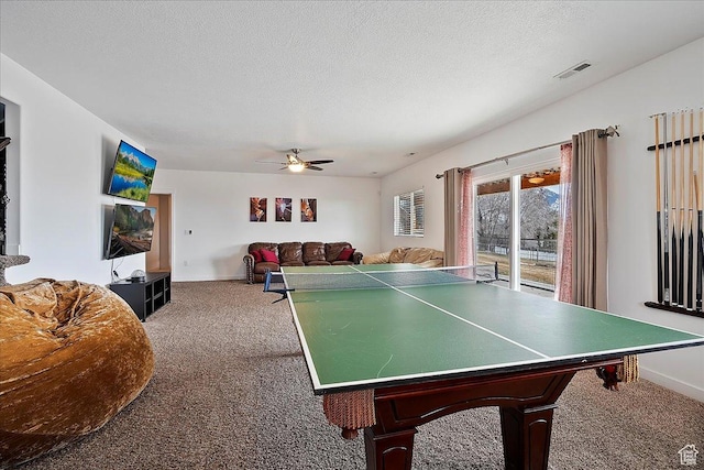 playroom featuring visible vents, carpet, ceiling fan, and baseboards