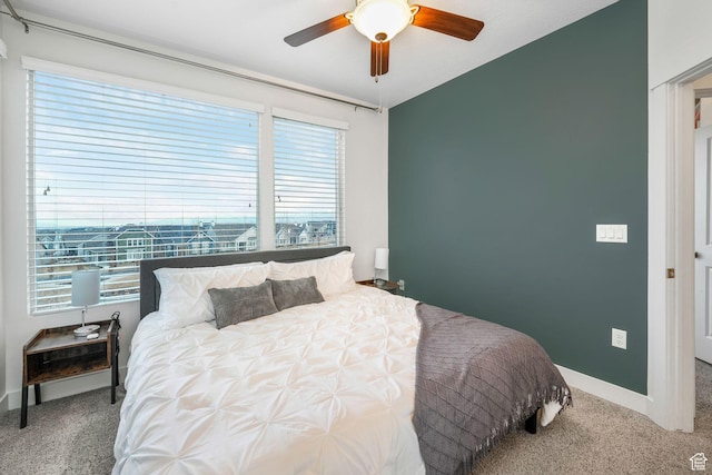 bedroom featuring carpet flooring, ceiling fan, and baseboards