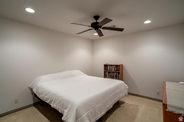 bedroom with baseboards, visible vents, light colored carpet, and recessed lighting