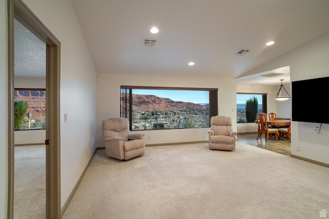 sitting room featuring carpet floors, recessed lighting, a healthy amount of sunlight, and visible vents
