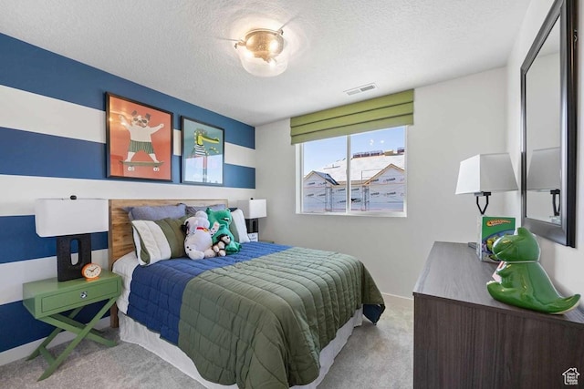 2893 S Malcom Pl Unit 9, West Valley City, UT 84128 - carpeted bedroom featuring a textured ceiling and baseboards