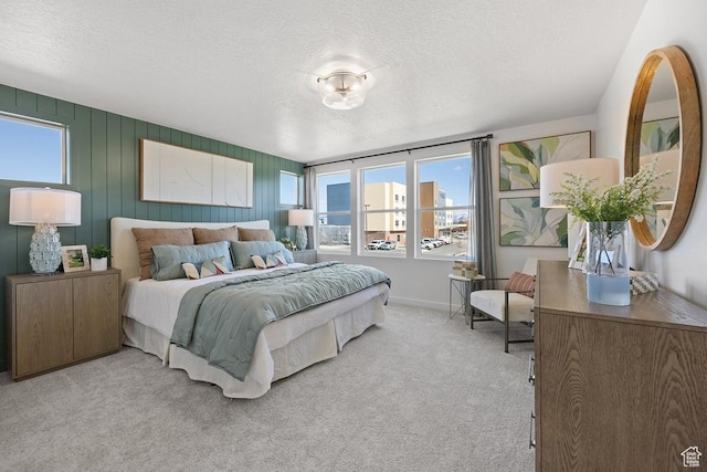 2893 S Malcom Pl Unit 9, West Valley City, UT 84128 - bedroom with carpet, multiple windows, and a textured ceiling